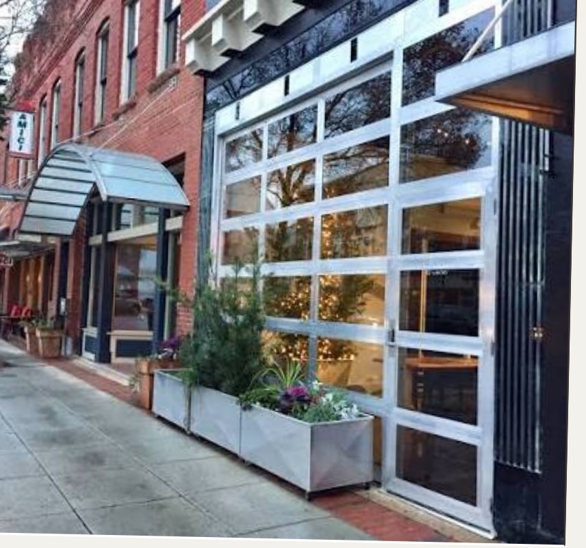 Wayfarer Hotel & Events storefront on a downtown street.